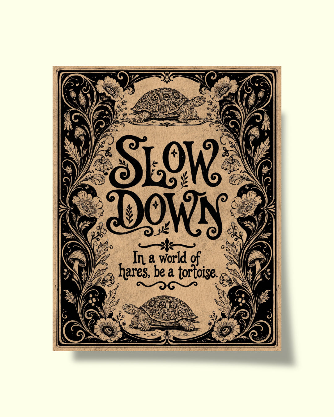 A square decorative art print or poster with ornate black floral scrollwork and the phrase 'SLOW DOWN In a world of hares, be a tortoise' on a warm beige background, shown against a light cream backdrop.